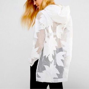 Free People White mesh hoodie with embroidery.